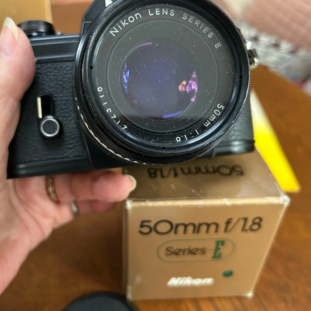 Vintage Nikon Black EM Film Camera w 50mmf/1.8 lens series E. Replaced lenscover